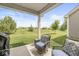 Relaxing back patio with views of the green landscape, perfect for enjoying the outdoors at 10814 Matherly Way, Noblesville, IN 46060
