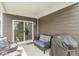 Covered patio includes comfortable seating and a grill, offering a great outdoor living space at 10814 Matherly Way, Noblesville, IN 46060