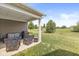 Relax on the covered patio with outdoor seating and a grill, perfect for entertaining guests at 10814 Matherly Way, Noblesville, IN 46060