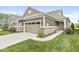 Beautiful single-Gathering home featuring a two-car garage, tidy lawn, and manicured landscaping at 10814 Matherly Way, Noblesville, IN 46060