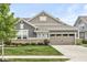 Attractive home featuring stone accents, a manicured lawn, and a two-car garage, offering curb appeal at 10814 Matherly Way, Noblesville, IN 46060