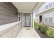 Inviting front porch with brick accents, a decorative front door, and a welcoming ambiance to greet visitors at 10814 Matherly Way, Noblesville, IN 46060