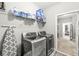 Convenient laundry room features a stainless steel washer/dryer set and ample storage space at 10814 Matherly Way, Noblesville, IN 46060