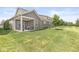 View of backyard, covered patio, and well-maintained landscaping of this beautiful residence at 10814 Matherly Way, Noblesville, IN 46060