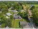 An aerial view showcases a charming home with a spacious yard and mature trees at 11315 House St, Indianapolis, IN 46259