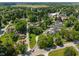 Aerial view showcasing a neighborhood surrounded by lush trees and greenery at 11315 House St, Indianapolis, IN 46259