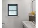 This bathroom features a window and a white vanity with a vessel sink at 11315 House St, Indianapolis, IN 46259
