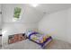 Bright bedroom featuring a skylight, plush carpeting and whimsical décor at 11315 House St, Indianapolis, IN 46259