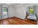 Bedroom with hardwood floors, natural lighting, and ample closet space at 11315 House St, Indianapolis, IN 46259