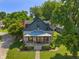 Charming home with inviting porch, stone accents, and meticulously maintained lawn at 11315 House St, Indianapolis, IN 46259