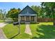 Charming home featuring stone accents, a covered porch, and a well-manicured lawn with a mailbox at 11315 House St, Indianapolis, IN 46259