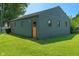 Detached single-car garage features charming doors and a well-maintained lawn at 11315 House St, Indianapolis, IN 46259