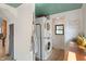 The laundry room features a stacked washer and dryer, and shelving at 11315 House St, Indianapolis, IN 46259