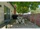 Cozy outdoor patio space complete with picnic table, grill, and decorative string lights at 11315 House St, Indianapolis, IN 46259