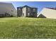 Spacious backyard featuring lush green grass, surrounded by neighboring homes at 12536 Teacup Ne Way, Indianapolis, IN 46235