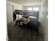 Bedroom featuring a bunk bed with colorful bedding and a neutral color scheme at 12536 Teacup Ne Way, Indianapolis, IN 46235