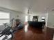 Spacious bonus room area with hardwood flooring, natural light, and gaming area at 12536 Teacup Ne Way, Indianapolis, IN 46235