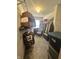 Well-organized walk-in closet with hanging clothes, shelves, and storage containers at 12536 Teacup Ne Way, Indianapolis, IN 46235