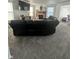 Cozy living room featuring plush carpeting, a fireplace, and a large sectional sofa at 12536 Teacup Ne Way, Indianapolis, IN 46235