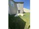 Concrete patio with green grass, plants and bushes at 12536 Teacup Ne Way, Indianapolis, IN 46235