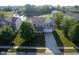 Aerial view of a charming two-story home, boasting a brick facade, attached garage, and lush green lawn at 12847 Arvada Pl, Fishers, IN 46038