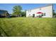 Large, well-maintained backyard features a patio with outdoor seating and a play structure at 12847 Arvada Pl, Fishers, IN 46038