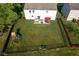Aerial view of a fenced backyard with a patio, outdoor seating, play equipment and a lush lawn at 12847 Arvada Pl, Fishers, IN 46038