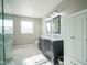 Elegant bathroom features a double vanity, granite countertop, and glass-enclosed shower at 12847 Arvada Pl, Fishers, IN 46038