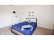 Blue bedroom with a dresser and wall decor at 12847 Arvada Pl, Fishers, IN 46038