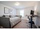 Bedroom with a full size bed, work station and neutral carpet at 12847 Arvada Pl, Fishers, IN 46038