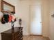 Entryway with a dark wood dresser, hat rack, and a white door, providing a functional space at 12847 Arvada Pl, Fishers, IN 46038