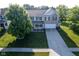 Beautiful two-story home featuring a well-manicured lawn, a two-car garage, and charming curb appeal at 12847 Arvada Pl, Fishers, IN 46038
