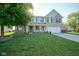 Inviting two-story home with lovely lawn and a charming front porch at 12847 Arvada Pl, Fishers, IN 46038