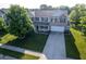 Beautiful two-story home featuring a well-manicured lawn, a two-car garage, and charming curb appeal at 12847 Arvada Pl, Fishers, IN 46038