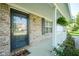 Welcoming covered front porch with glass door and brick facade at 12847 Arvada Pl, Fishers, IN 46038