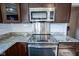 Kitchen features stainless steel range, granite countertops, and subway tile backsplash at 12847 Arvada Pl, Fishers, IN 46038