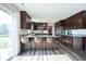 Modern kitchen featuring stainless steel appliances, granite countertops, and a breakfast bar with seating at 12847 Arvada Pl, Fishers, IN 46038