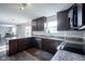 Open kitchen boasts stainless steel appliances, subway tile backsplash and wood grain flooring at 12847 Arvada Pl, Fishers, IN 46038