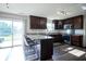 Stylish kitchen featuring granite countertops, stainless steel appliances, and a breakfast bar with seating at 12847 Arvada Pl, Fishers, IN 46038