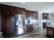Kitchen features stainless steel appliances, granite countertops, and custom cabinetry at 12847 Arvada Pl, Fishers, IN 46038