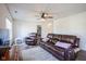 Cozy living room with a leather sofa, recliner and neutral rug and paint at 12847 Arvada Pl, Fishers, IN 46038