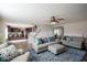 Open concept living room showing the stairs to the second floor, the dining room, and the kitchen at 12847 Arvada Pl, Fishers, IN 46038