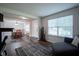 Open-concept living space with dining area, abundant natural light, and hardwood floors at 12847 Arvada Pl, Fishers, IN 46038