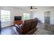Bright living room with a TV, a wood-look floor and access to bedroom at 12847 Arvada Pl, Fishers, IN 46038