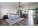Spacious main bedroom with a large rug, ceiling fan, ensuite bathroom and walk-in closet at 12847 Arvada Pl, Fishers, IN 46038