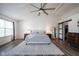 Main bedroom boasts a king-size bed, ceiling fan, hardwood floors, and walk-in closet at 12847 Arvada Pl, Fishers, IN 46038