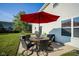 Outdoor patio featuring a table with chairs and a large umbrella for shade at 12847 Arvada Pl, Fishers, IN 46038