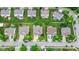 An aerial view shows a neighborhood featuring well-maintained homes and green lawns at 12997 Bartlett Dr, Fishers, IN 46037