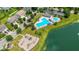 Aerial view of a community playground, pool and lake, perfect for a Gathering-friendly lifestyle at 12997 Bartlett Dr, Fishers, IN 46037