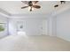 Large bedroom featuring bright walls, lots of sunlight from an adjacent room, and carpet floors at 12997 Bartlett Dr, Fishers, IN 46037